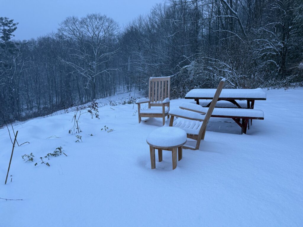 GOLDENTEAK Rocking Chairs and furniture in the snow.