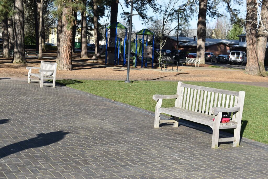 GOLDENTEAK Hydepark Benches in a Town Setting