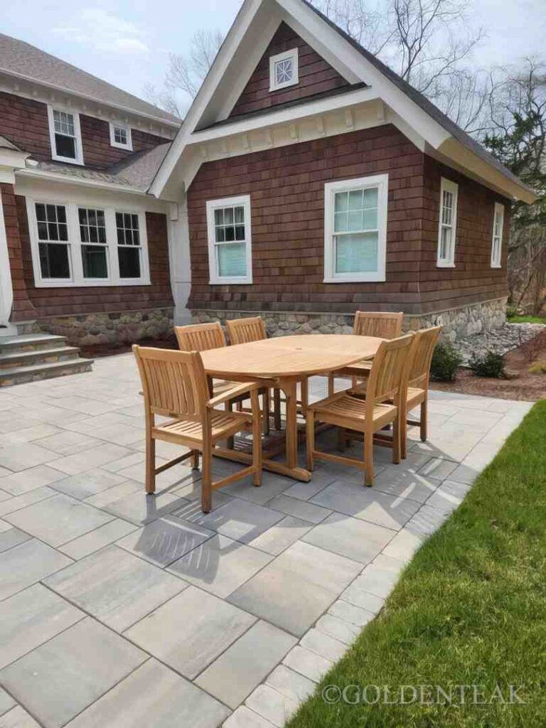 Grade A teak patio table outdoor dining set on sun-drenched patio - Grade A teak patio table
