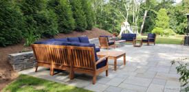 Goldenteak Deep Seating Sectionals and Club Chairs on Patio