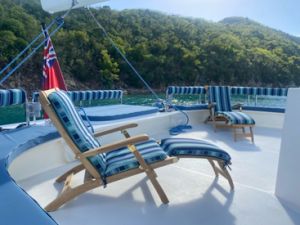 Goldenteak Teak Steamer Chair on Charter Boat in Caribbean