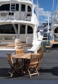 Teak Octagon Folding Table and Teak Providence Chairs at large Yacht Company.
