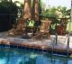 Teak Steamer Chairs with end table next to pool - customer photo