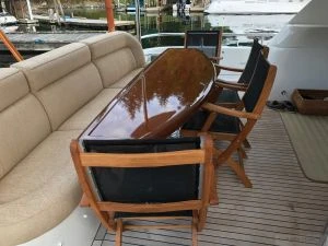 Teak Providence Chair Sling Black on Boat - Goldenteak Photo