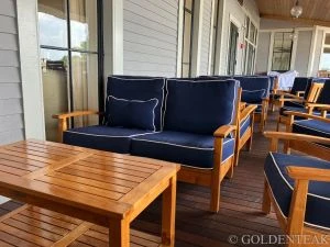 Goldenteak Teak Outdoor Loveseats, Club Chairs and coffee tables at Country Club