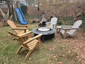 Two New GOLDENTEAK Teak Adirondacks pictured with two older (couple of years) GOLDENTEAK Adirondacks. 